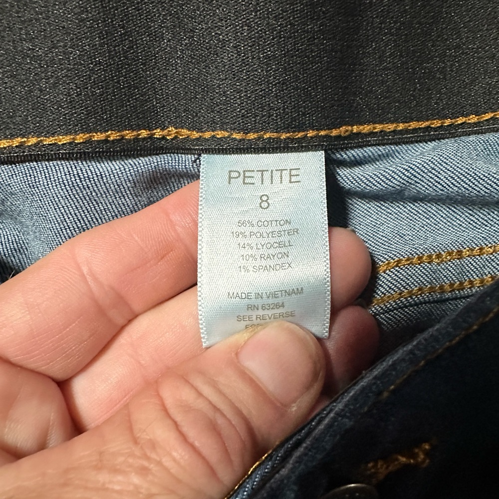 Size 8 petite. Blue in color with the fade through the thighs.